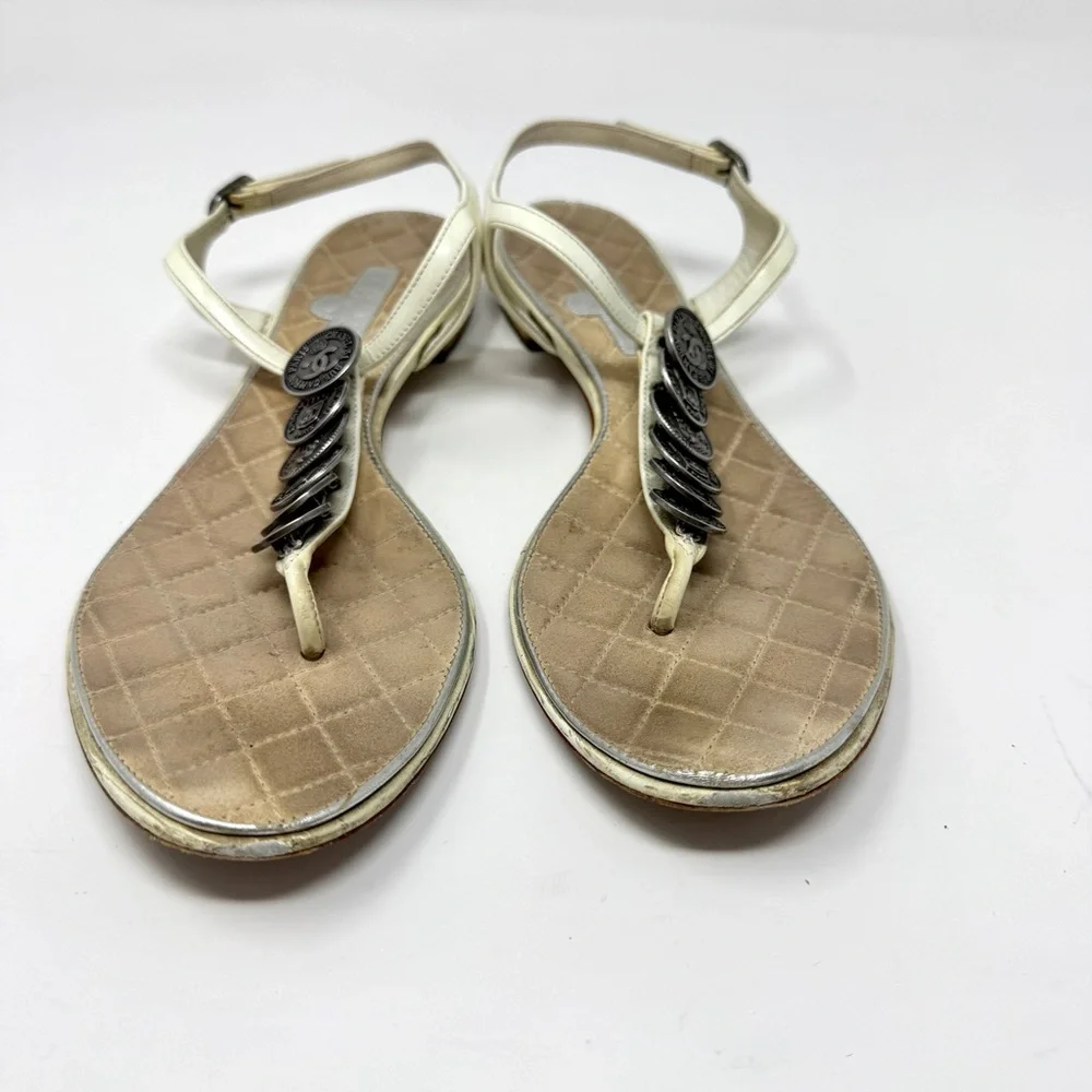 CHANEL White Leather Thong Sandals with Stacked Silver Coin Medallions